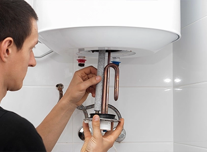 Technician Performing Water Heater Repair in Weymouth MA